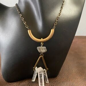 Handcrafted necklace raw quartz crystals hanging from brass hardware